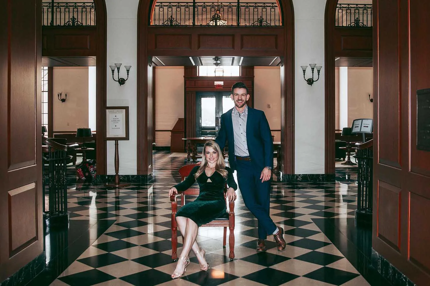 A couple in evening outfits in fancy interior