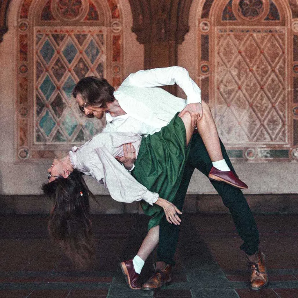 A couple posing during engagement photoshoot on Bethesda terrace in Central Park in NYC by best engagement photographer Ivan Djikaev, Mind On Photography