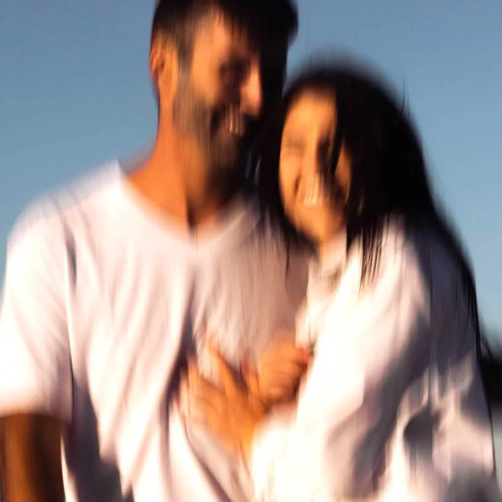 Contemporary artistic photo of a couple in love on the beach on Cape Cod by coolest engagement photographer Ivan Djikaev, Mind On Photography